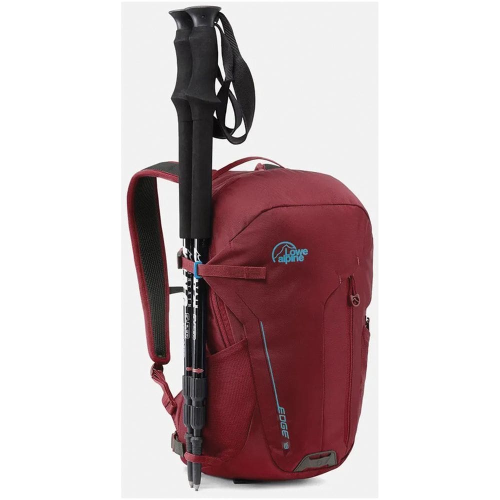 A red backpack with an umbrella attached to it.